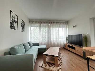 Télévision ou salle de divertissement dans l'établissement La Suite Aurence, chic et calme