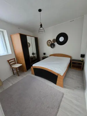 Un ou plusieurs lits dans un hébergement de l'établissement Appartement rez de jardin avec terrasse privative