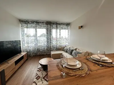 Télévision ou salle de divertissement dans l'établissement La Suite Vienne, chic et calme