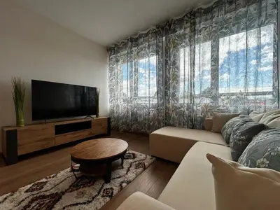 Télévision ou salle de divertissement dans l'établissement La Suite Vienne, chic et calme