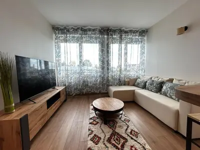 Télévision ou salle de divertissement dans l'établissement La Suite Vienne, chic et calme