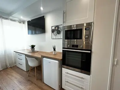 Cuisine ou kitchenette dans l'établissement La Suite Faïence, chic et calme