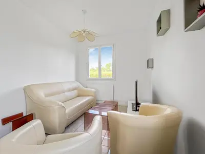 Coin salon dans l'établissement Le Priou - Maison Avec Grand Jardin