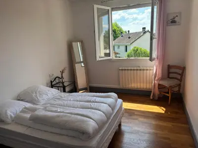 Un ou plusieurs lits dans un hébergement de l'établissement Appartement confortable avec jardin à Objat, 120 m²