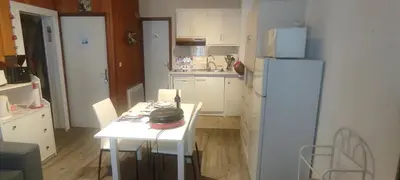 Cuisine ou kitchenette dans l'établissement Appartement Au Cœur du Village