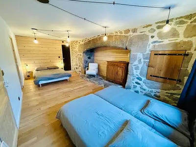 Un ou plusieurs lits dans un hébergement de l'établissement Maison cosy avec sauna en montagne