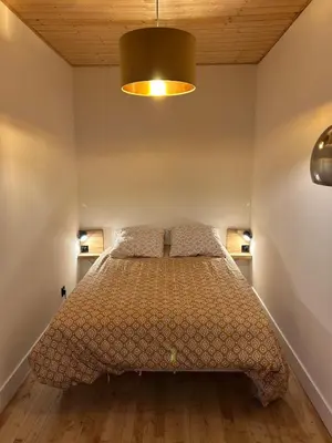 Un ou plusieurs lits dans un hébergement de l'établissement Maison cosy avec sauna en montagne
