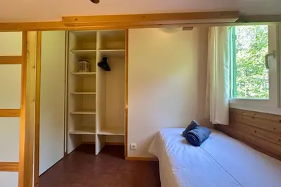Un ou plusieurs lits dans un hébergement de l'établissement Chalet de 4 pers - Lac de Miel à 500m - Beynat - Parking Piscine