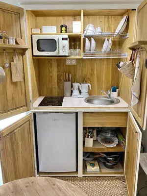 Cuisine ou kitchenette dans l'établissement Le Boudoir de Syssi