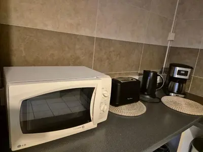 Cuisine ou kitchenette dans l'établissement Gite le petit Ely