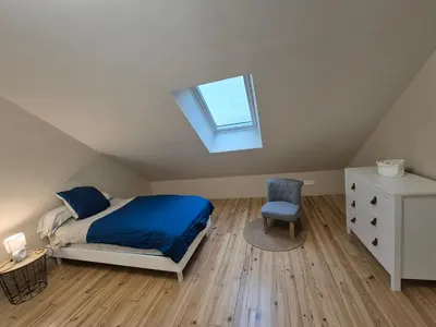 Un ou plusieurs lits dans un hébergement de l'établissement Gite le petit Ely