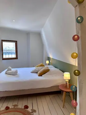 Un ou plusieurs lits dans un hébergement de l'établissement Casa Majour - Duplex coeur de ville - T2 - Climatisé