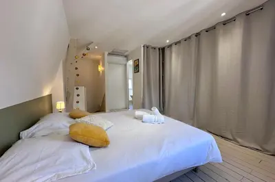 Un ou plusieurs lits dans un hébergement de l'établissement Casa Majour - Duplex coeur de ville - T2 - Climatisé