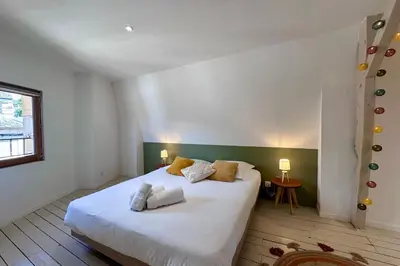 Un ou plusieurs lits dans un hébergement de l'établissement Casa Majour - Duplex coeur de ville - T2 - Climatisé
