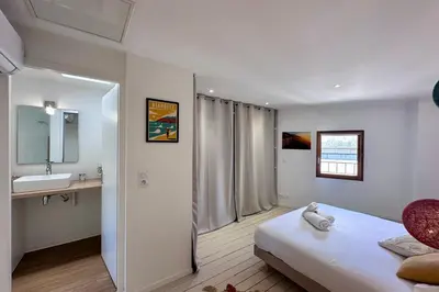 Un ou plusieurs lits dans un hébergement de l'établissement Casa Majour - Duplex coeur de ville - T2 - Climatisé
