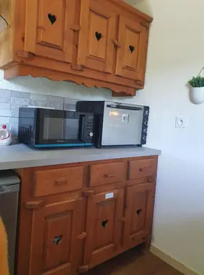 Cuisine ou kitchenette dans l'établissement Résidence La Rose