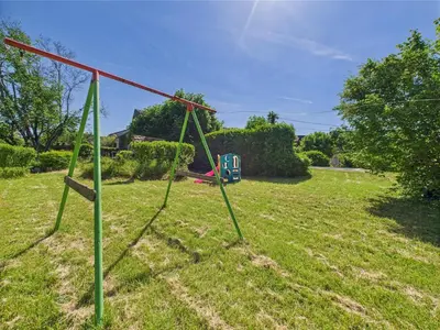 Jardin de l'établissement Gîte mitoyen - piscine commune - 4 personnes