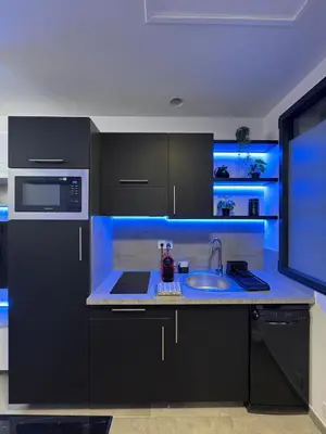Cuisine ou kitchenette dans l'établissement - Aux Bulles 2 - Suite & SPA - By Skyline Résidence