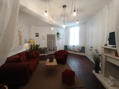 Télévision ou salle de divertissement dans l'établissement Le Liberté appartement privatif