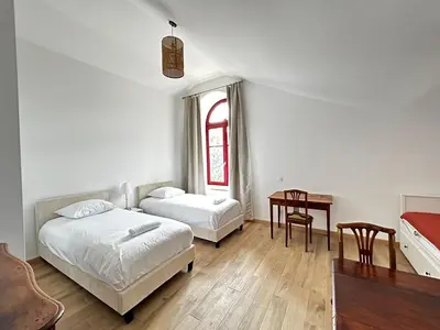 Un ou plusieurs lits dans un hébergement de l'établissement Les Ecuries, sur un domaine châtelain