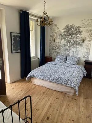Un ou plusieurs lits dans un hébergement de l'établissement Maison au cœur de ville