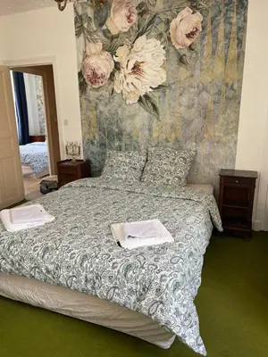 Un ou plusieurs lits dans un hébergement de l'établissement Maison au cœur de ville