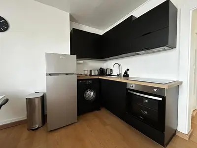 Cuisine ou kitchenette dans l'établissement Le Quartier des Saveurs, proche des Halles Carnot