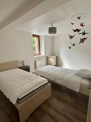 Un ou plusieurs lits dans un hébergement de l'établissement La Maison du Ruisseau