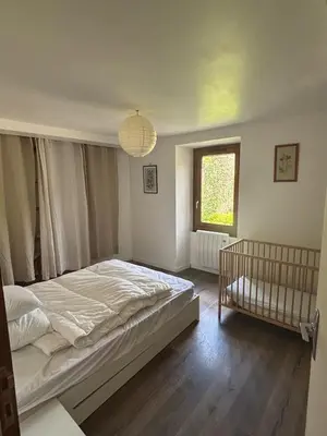 Un ou plusieurs lits dans un hébergement de l'établissement La Maison du Ruisseau
