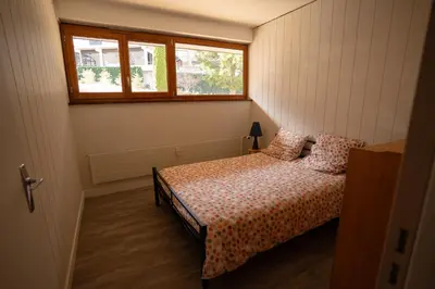 Un ou plusieurs lits dans un hébergement de l'établissement Appartement 5 personnes avec garage, balcon et belle vue