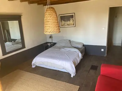Un ou plusieurs lits dans un hébergement de l'établissement Vakantiehuis in groene oasis