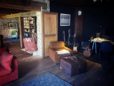 Coin salon dans l'établissement Vakantiehuis in groene oasis