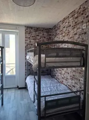 Un ou plusieurs lits dans un hébergement de l'établissement le nid des choups esprit loft 50 m2