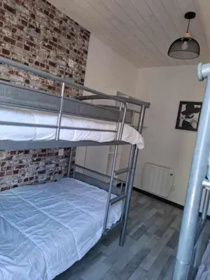 Un ou plusieurs lits dans un hébergement de l'établissement le nid des choups esprit loft 50 m2
