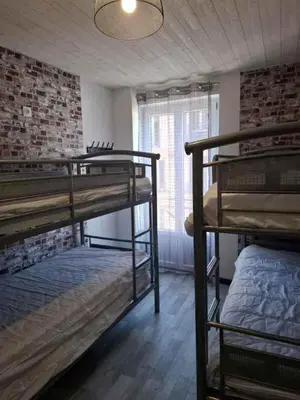 Un ou plusieurs lits dans un hébergement de l'établissement le nid des choups esprit loft 50 m2
