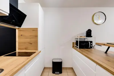 Cuisine ou kitchenette dans l'établissement Le confortable - Proche gare -