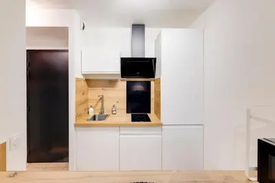 Cuisine ou kitchenette dans l'établissement Le confortable - Proche gare -