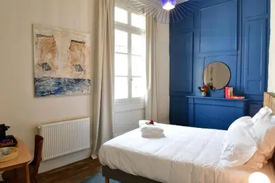Un ou plusieurs lits dans un hébergement de l'établissement Les Chambres du Cloître, la Beurrière