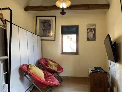 Télévision ou salle de divertissement dans l'établissement Gite - Maison Camembert Carennac