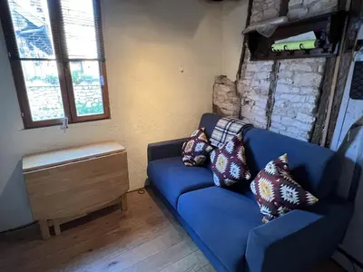 Coin salon dans l'établissement Gite - Maison Camembert Carennac