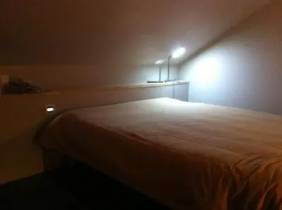 Un ou plusieurs lits dans un hébergement de l'établissement Les lauriers du loft