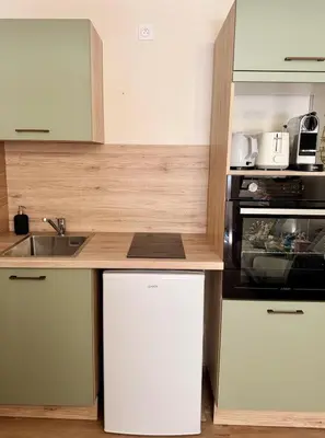 Cuisine ou kitchenette dans l'établissement Élégant duplex dans le centre historique