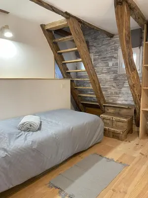 Un ou plusieurs lits dans un hébergement de l'établissement Maison de charme 4 personnes
