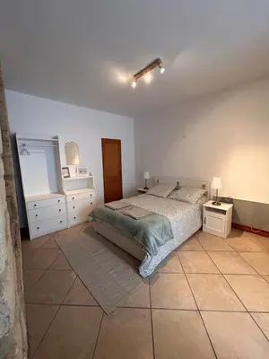 Un ou plusieurs lits dans un hébergement de l'établissement Petite maison au pied du château