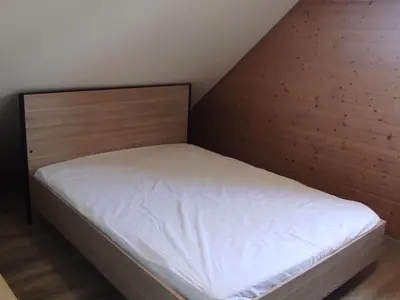 Un ou plusieurs lits dans un hébergement de l'établissement Chalet montagnard confortable à Super Besse avec grand terrain et parking privé - FR-1-814-139