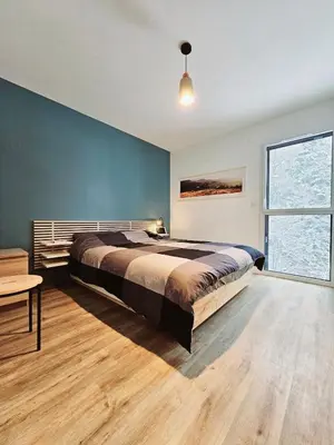 Un ou plusieurs lits dans un hébergement de l'établissement MAGNIFIQUE APPARTEMENT DUPLEX - 13 personnes