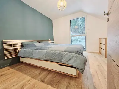 Un ou plusieurs lits dans un hébergement de l'établissement MAGNIFIQUE APPARTEMENT DUPLEX - 13 personnes