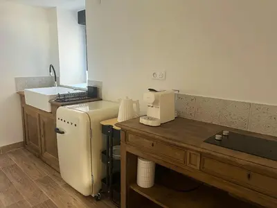 Cuisine ou kitchenette dans l'établissement Le Moulin de Lauve