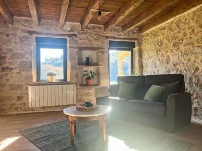 Coin salon dans l'établissement Le Moulin de Lauve