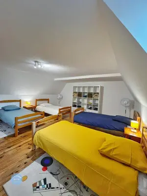 Un ou plusieurs lits dans un hébergement de l'établissement Les Glycines - Maison familiale avec jardin, entre nature et confort